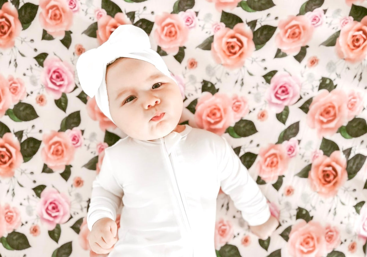 Baby girl wearing white Tencel lyocell footie