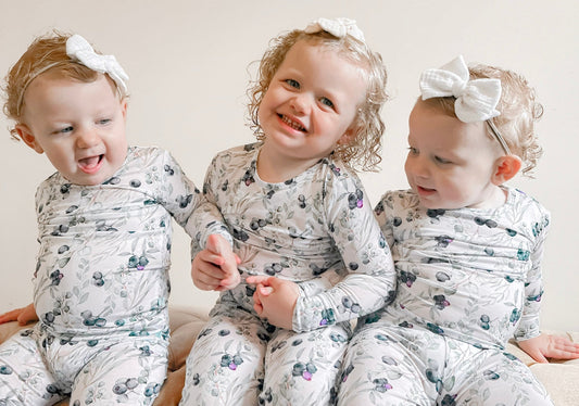 little girls sitting and smiling