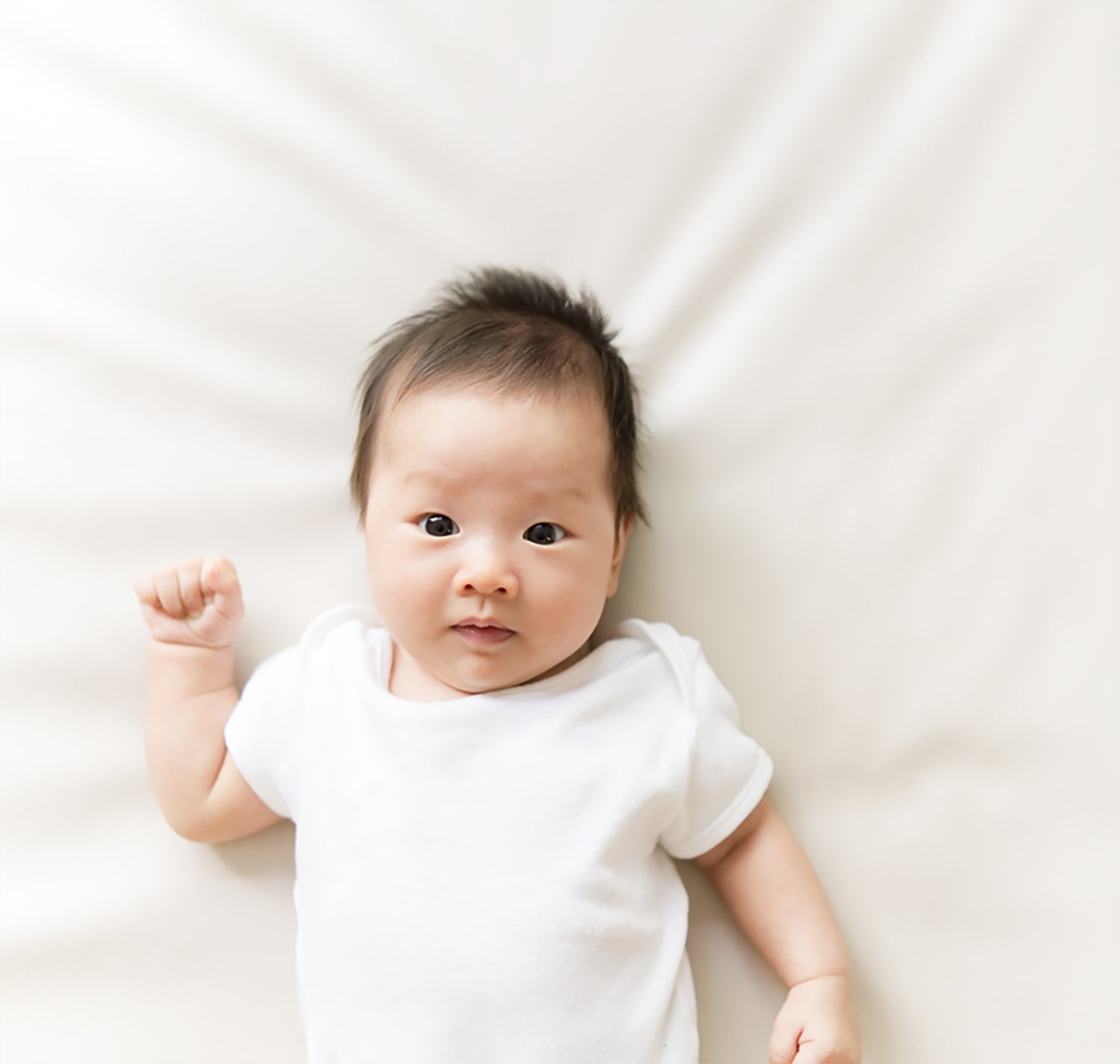 Baby wearing 3-6 month clothes bodysuit