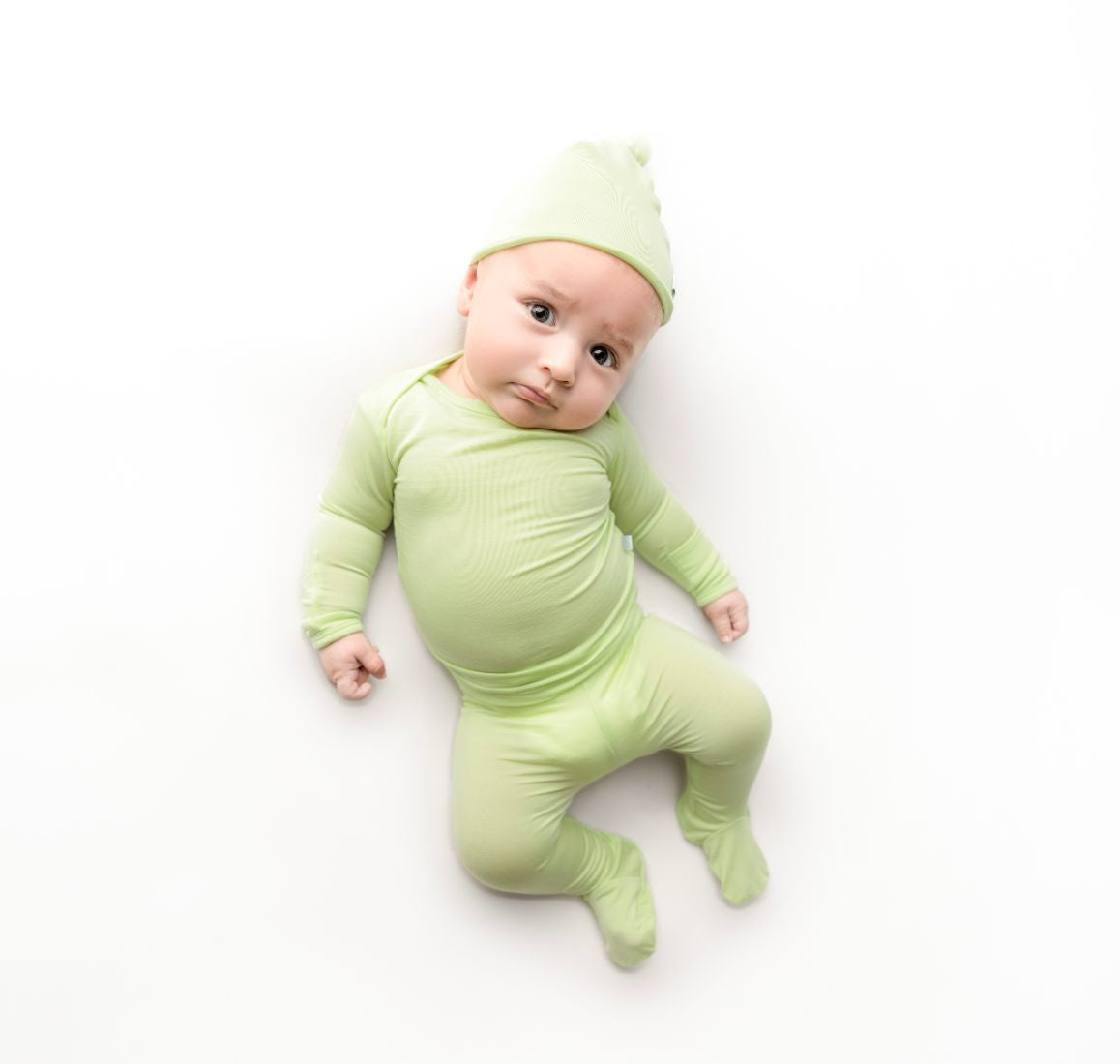Baby boy wearing newborn Cuddle Sprouts outfit