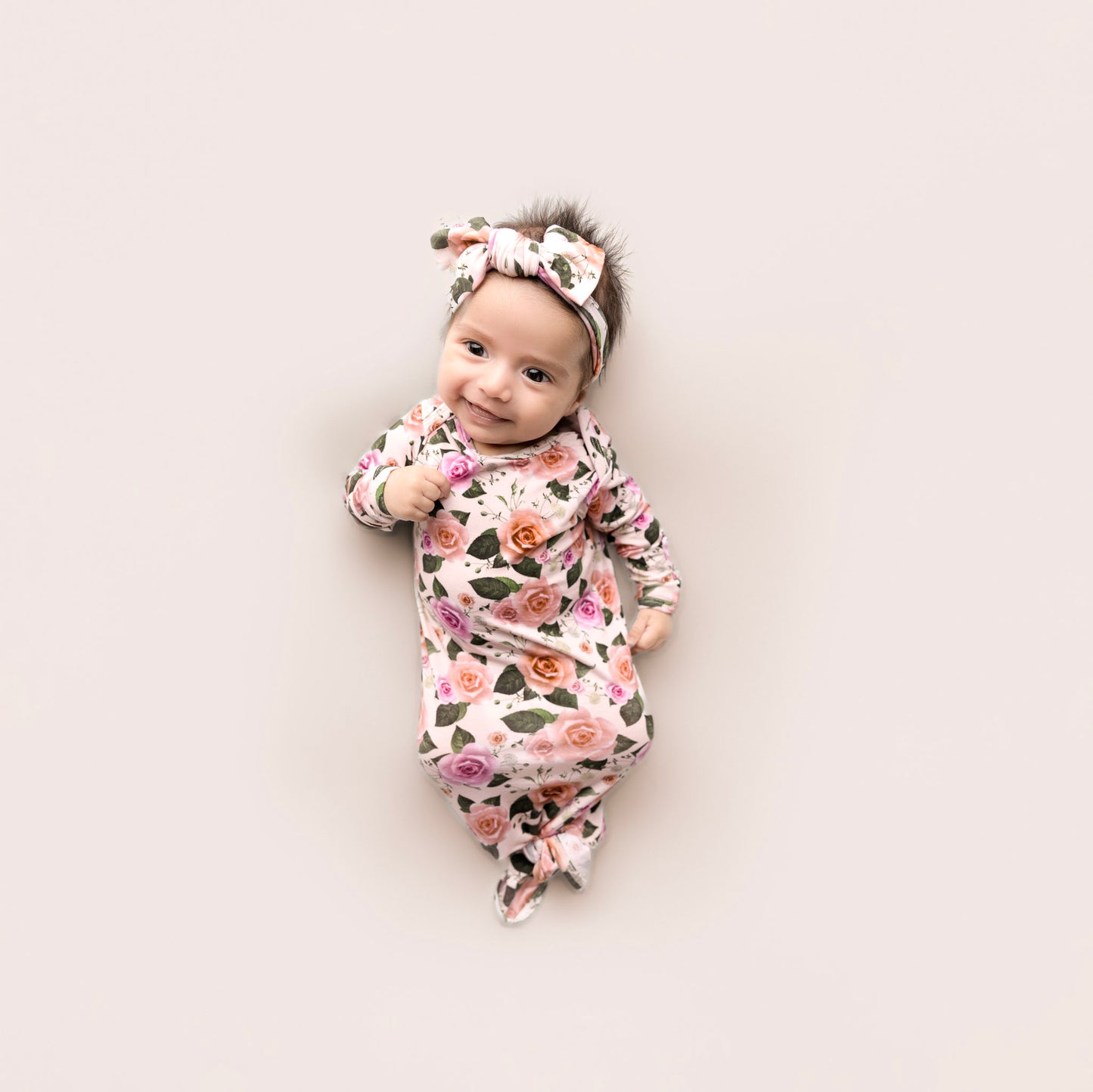 baby girl wearing floral knotted gown