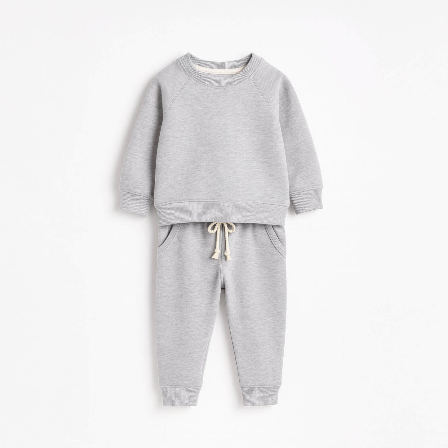 Gray children's sweatshirt and pants set on a white background