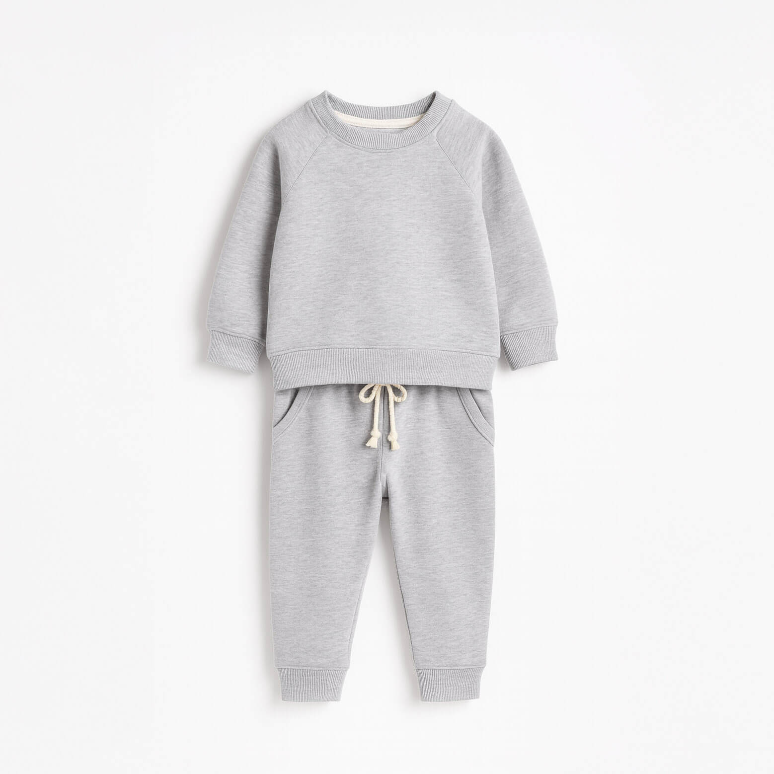 Gray children's sweatshirt and pants set on a white background