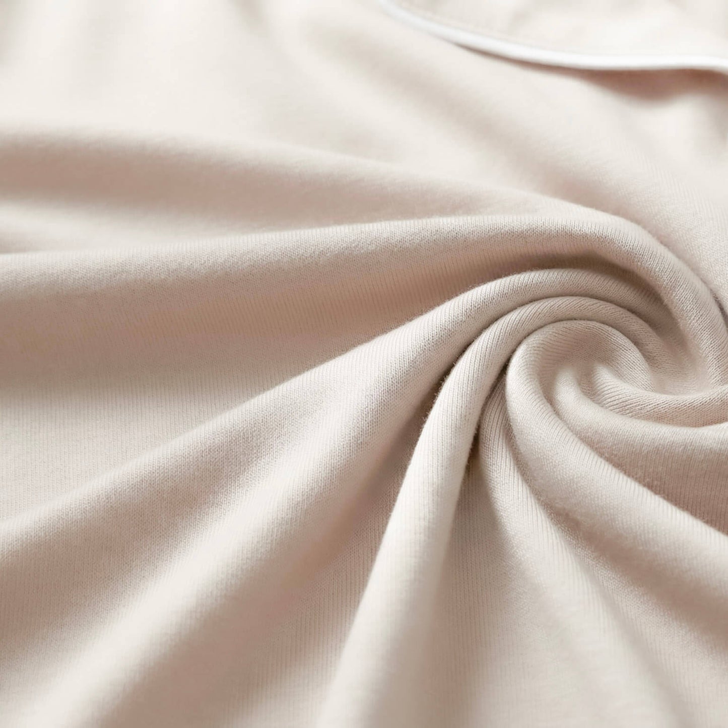 Close-up of beige fabric with folds
