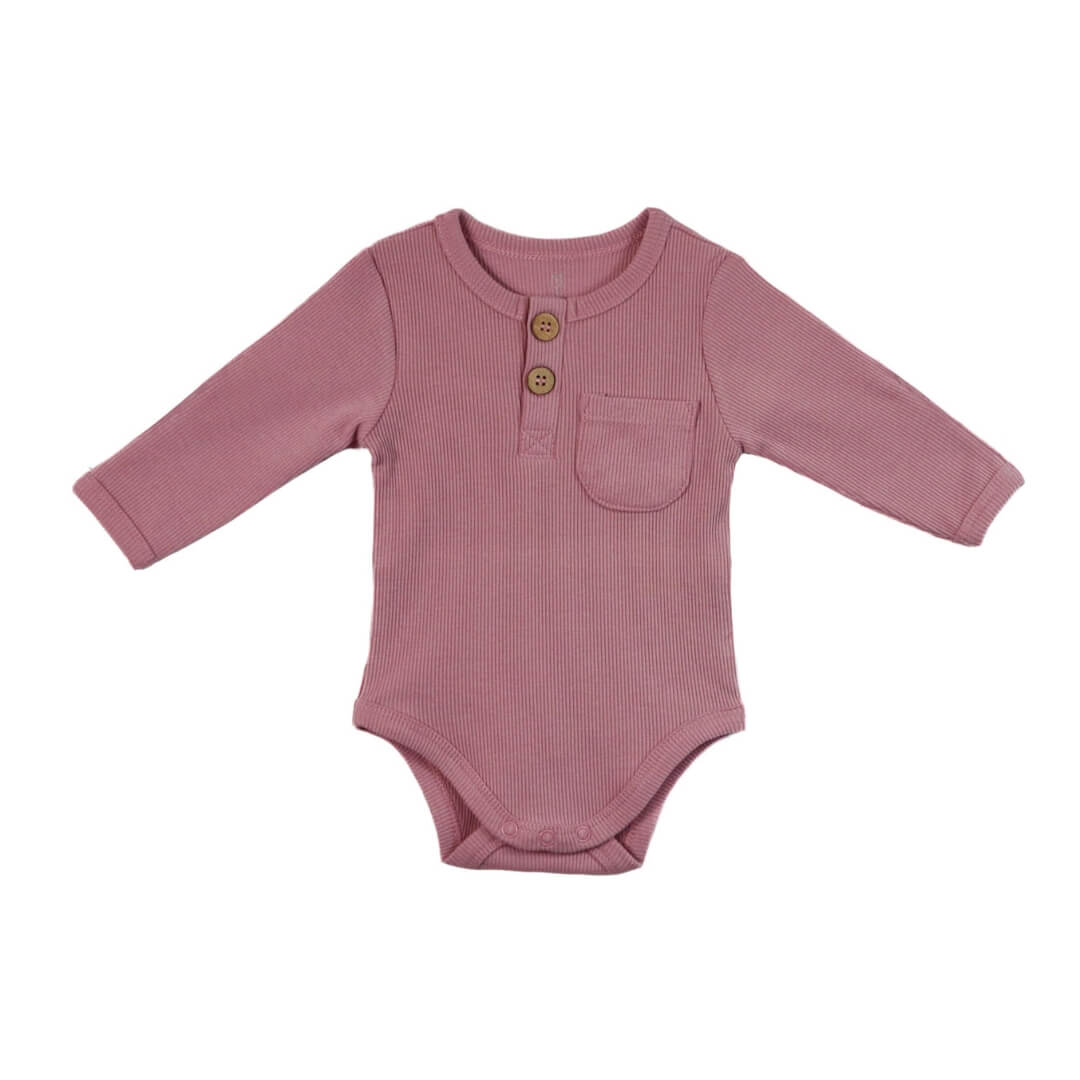 A long-sleeve purple bodysuit for babies with a Henley-style wooden button placket and a chest pocket.