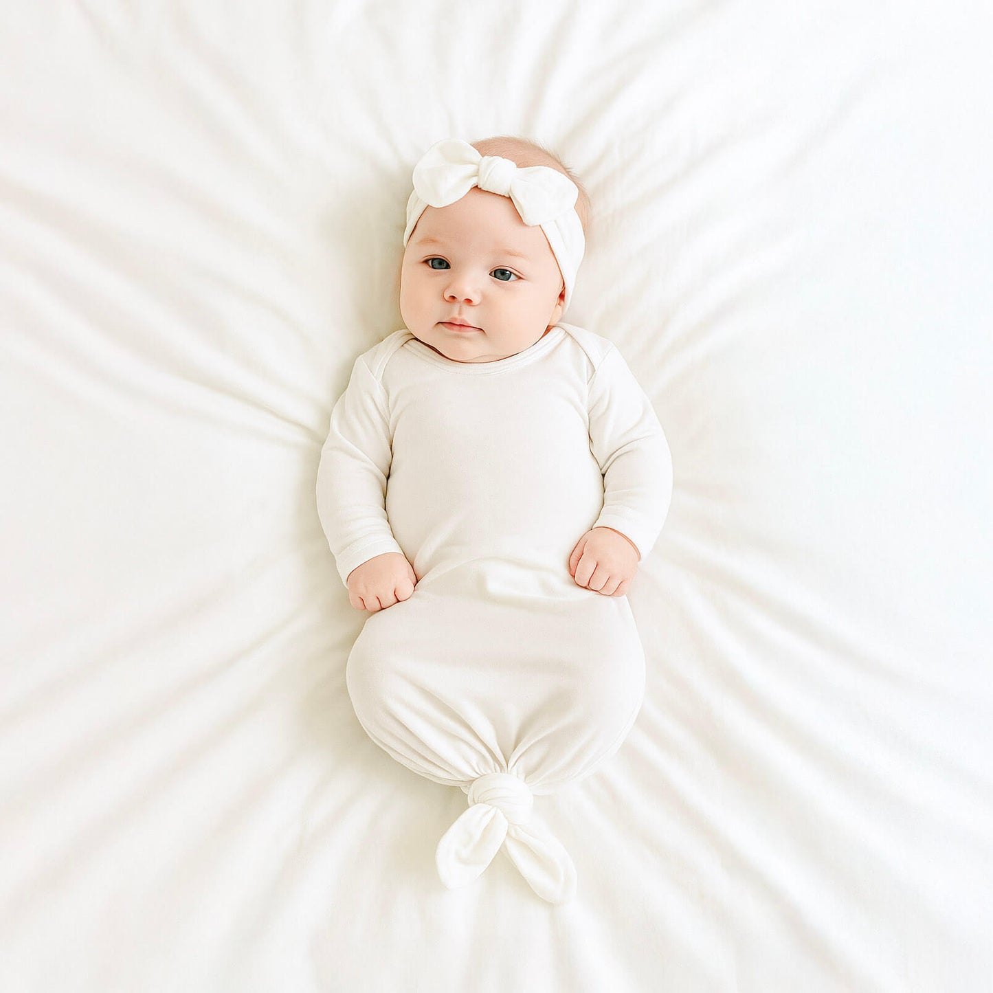 baby-girl-wearing-white-gown made of tencel lyocell