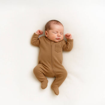 newborn baby wearing brown footie