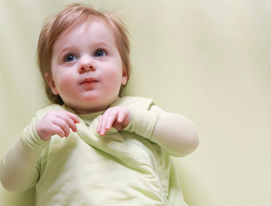 baby girl wearing green clothes