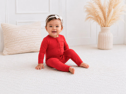 baby girl wearing red footie