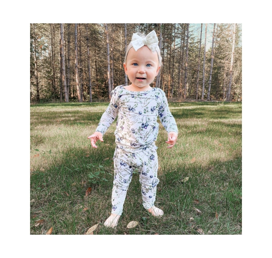 baby girl outdoors wearing 12-18  Month Clothes