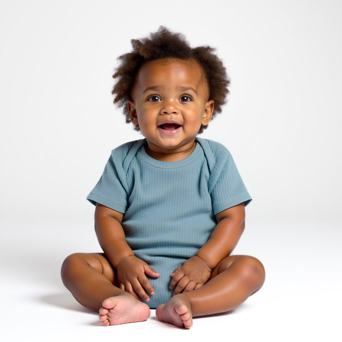 baby boy wearing blue ribbed bodysuit 