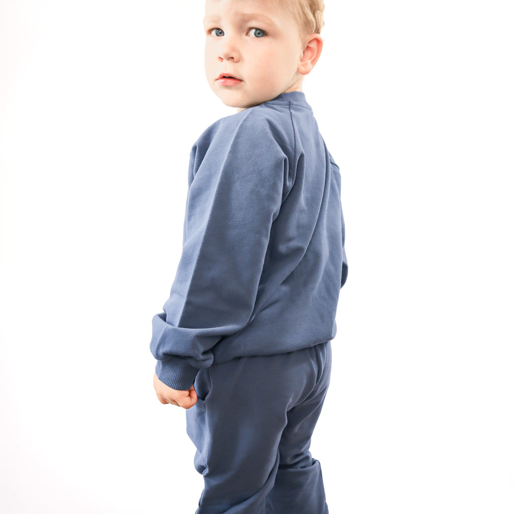 toddler wearing blue set 