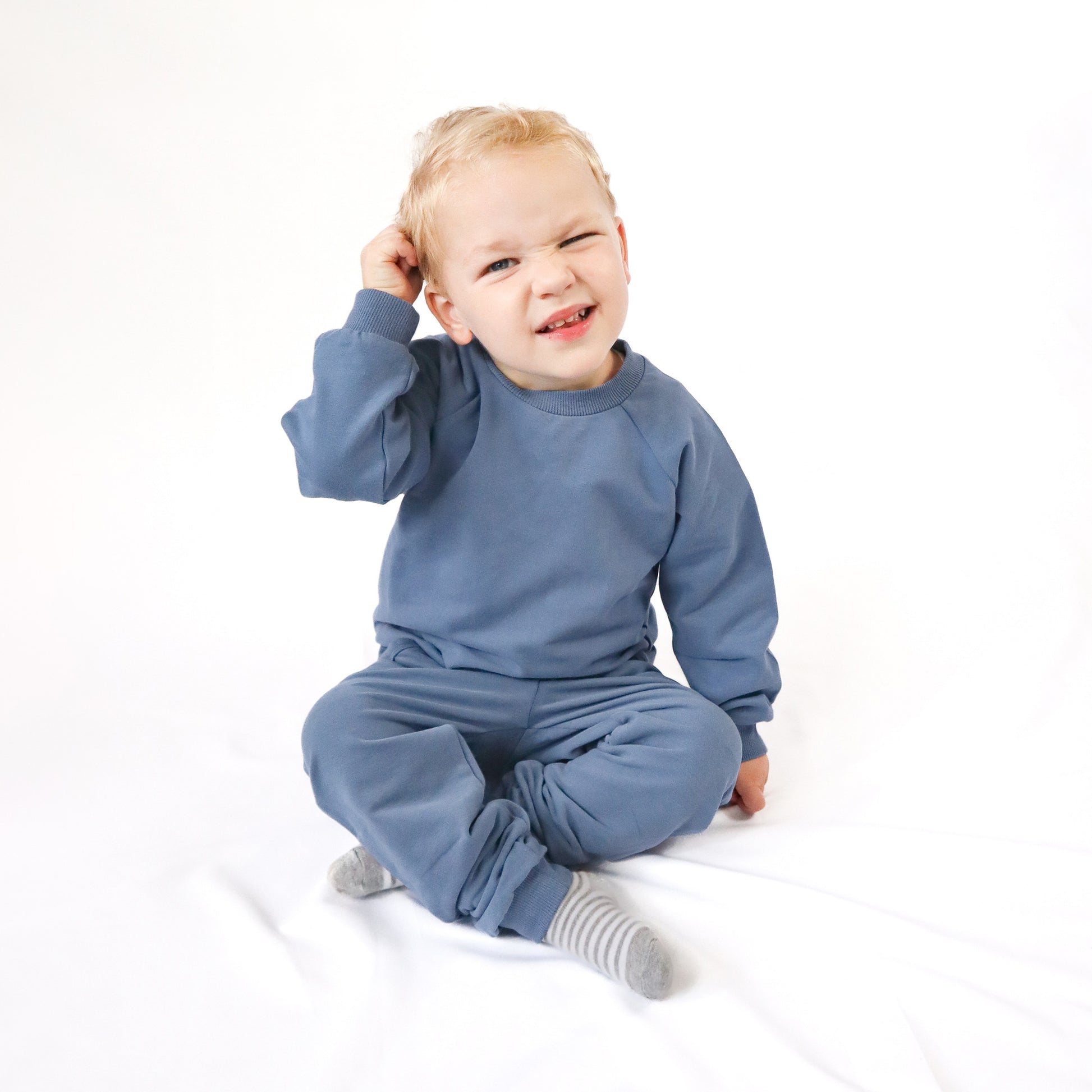 toddler sitting wearing jogger set