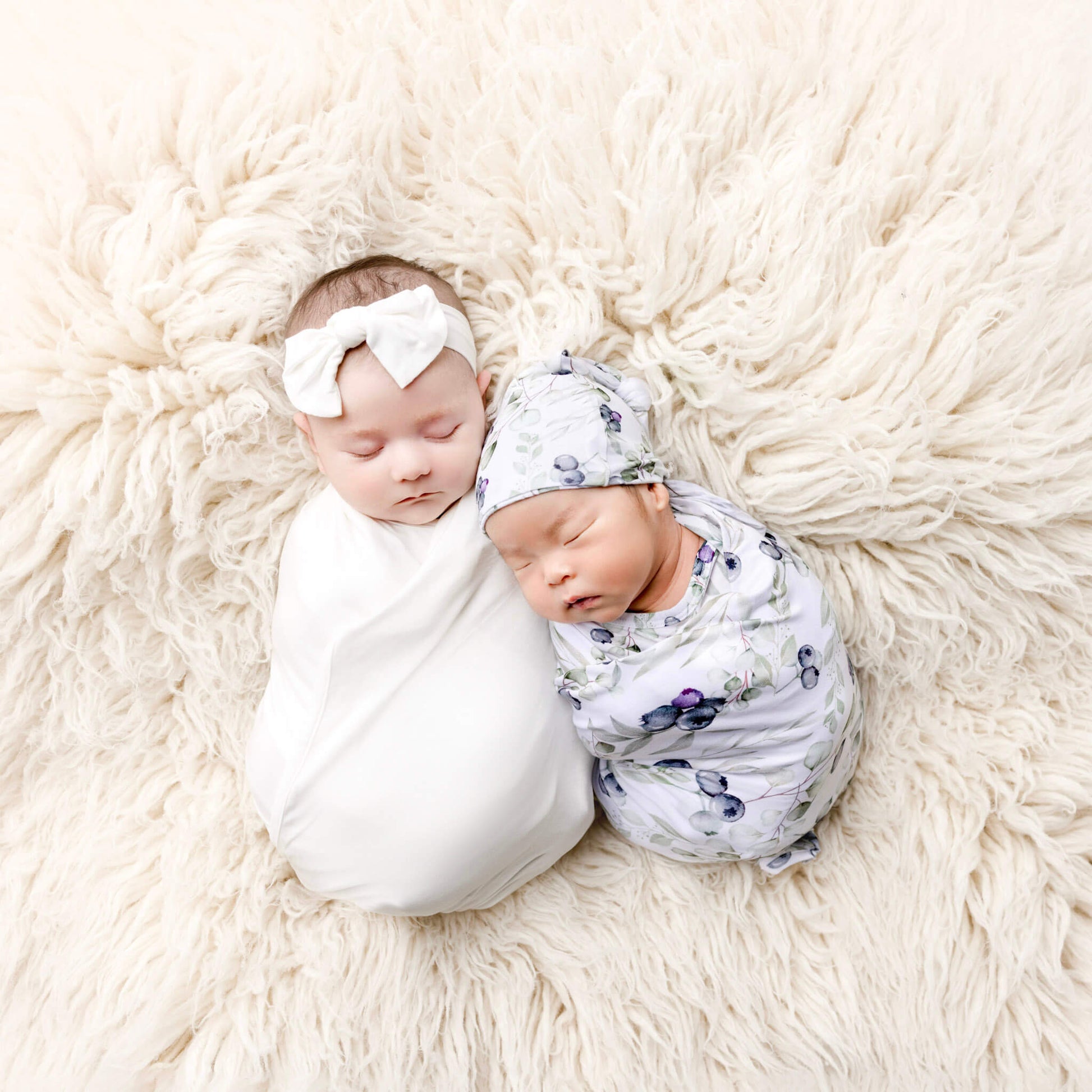 newborn babies being swaddle