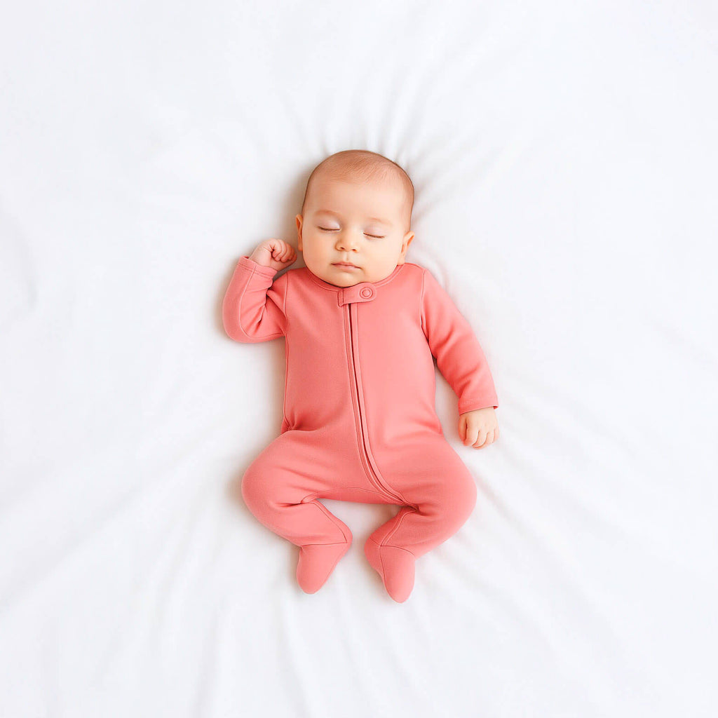 Baby wearing pink onesie 