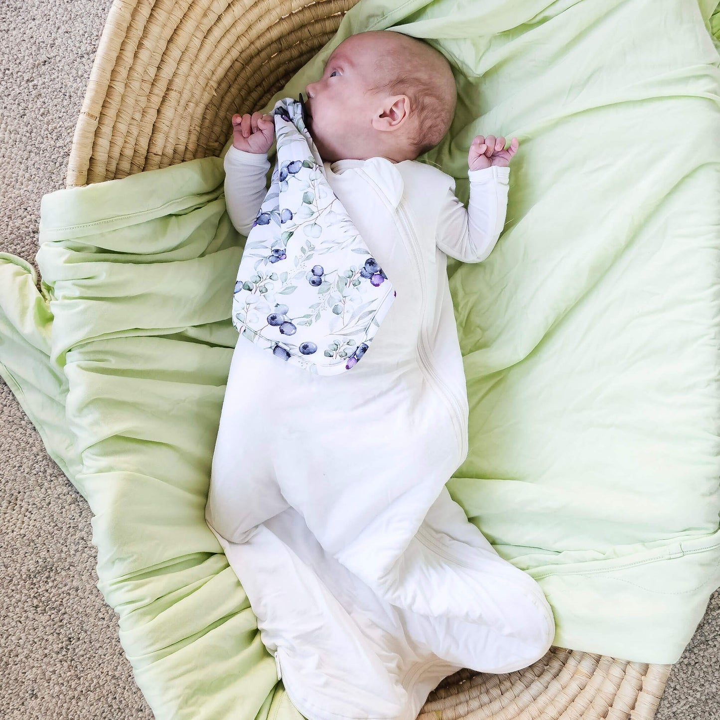 baby wearing white tencel sleep sack