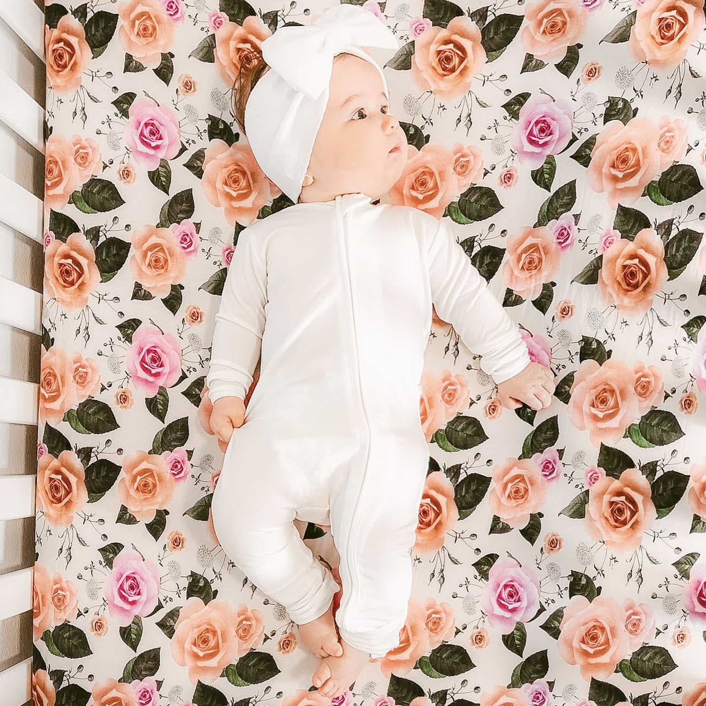 baby girl wearing white convertible footie pajamas made with Tencel Lyocell fabric 