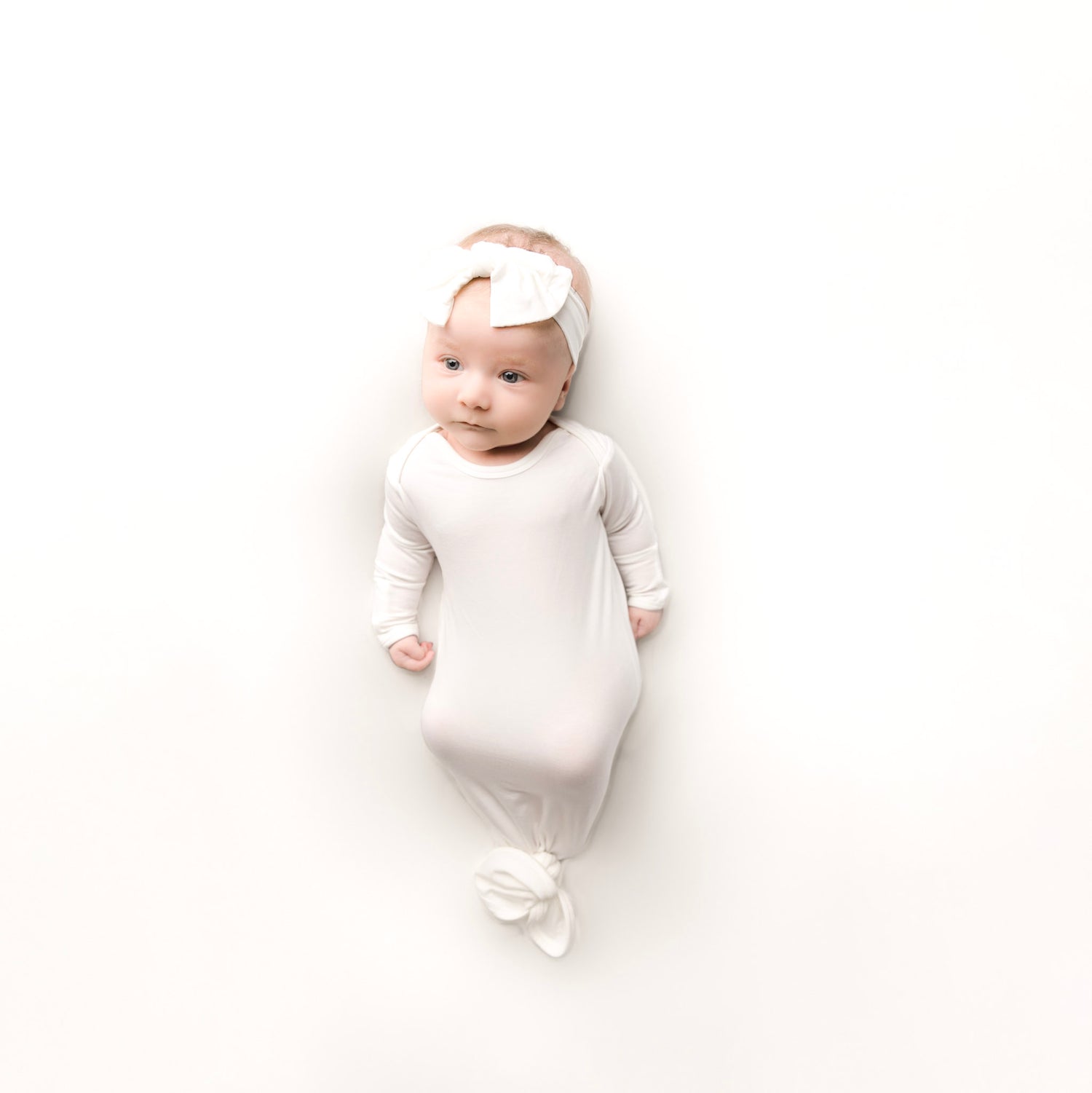 Baby girl wearing neutral baby clothes