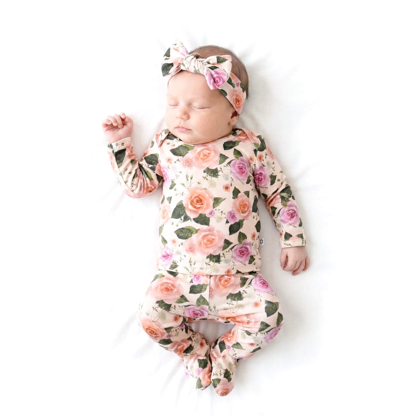 baby wearing floral outfit 