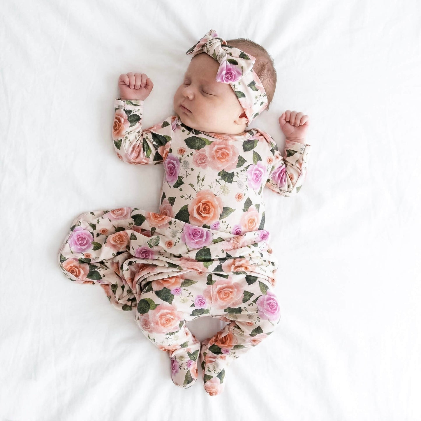 newborn baby wearing floral set