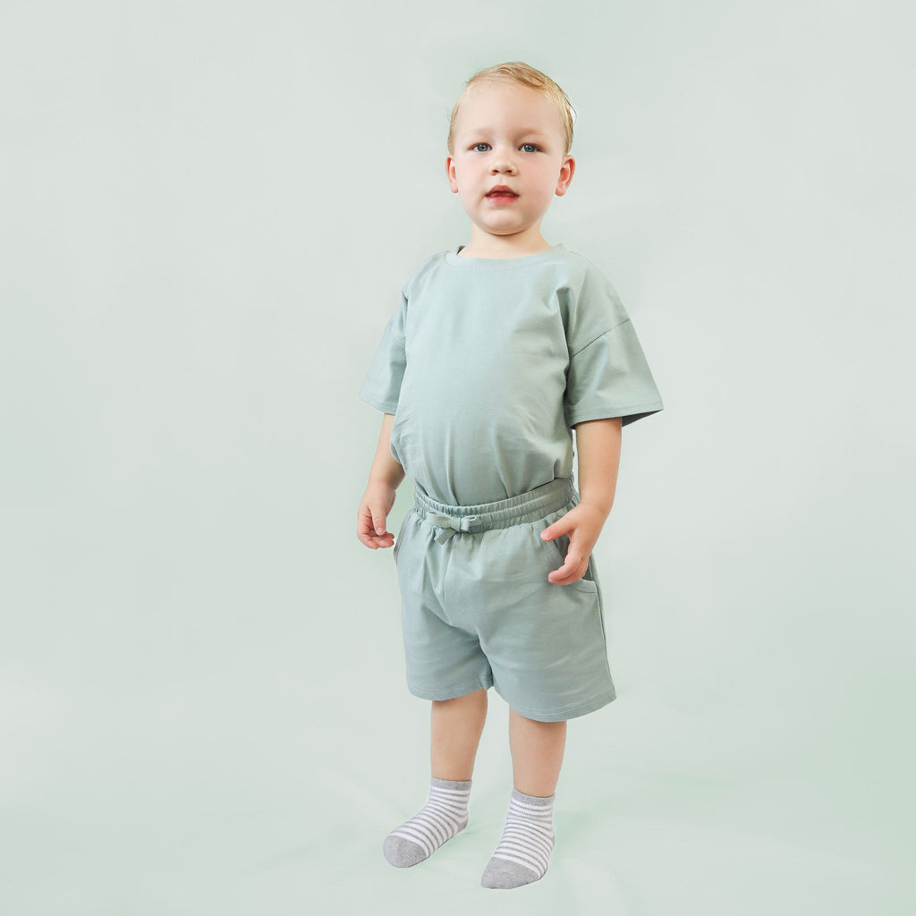 Boy wearing summer set in Sage Green color