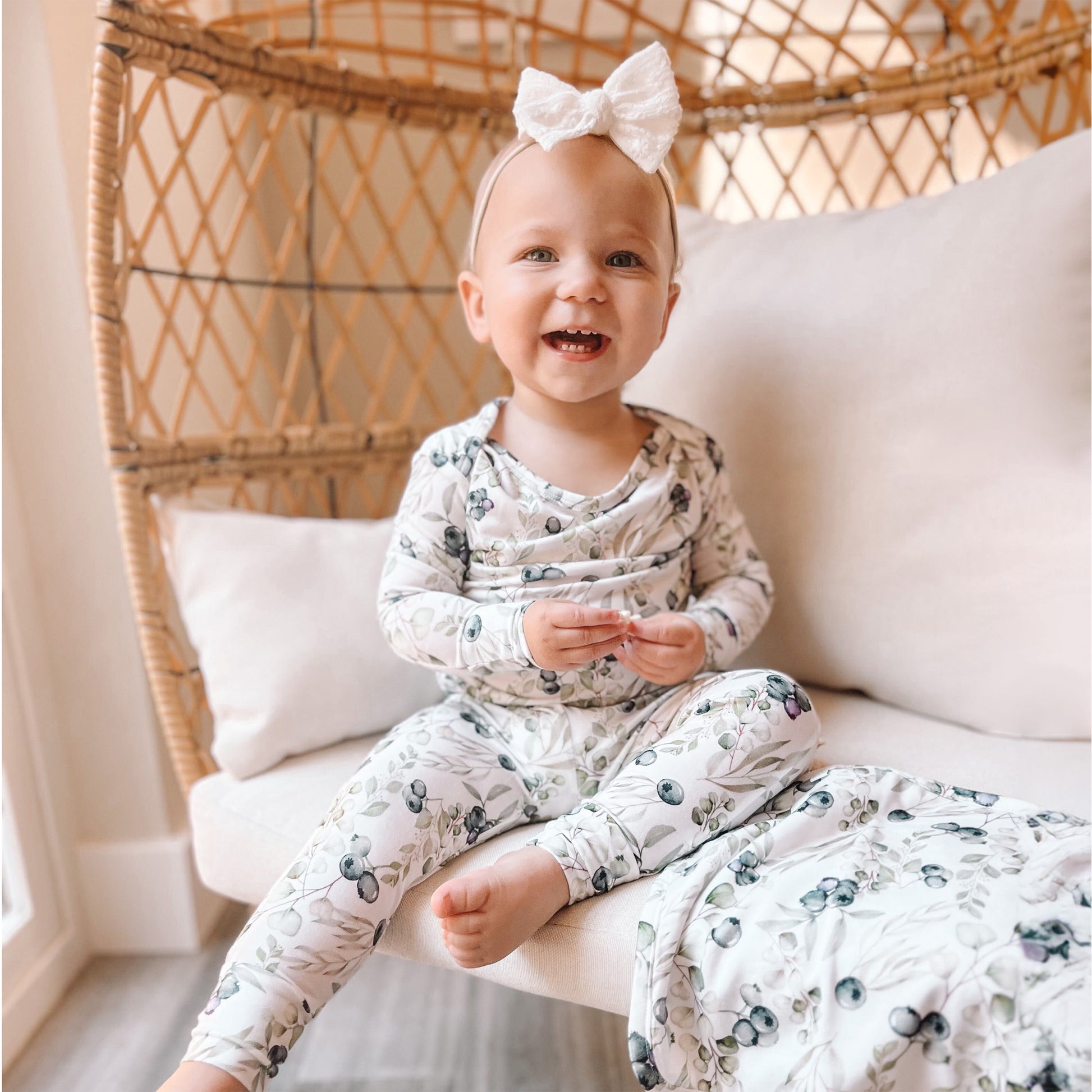 Little girl wearing blueberries 2 piece baby pajamas 