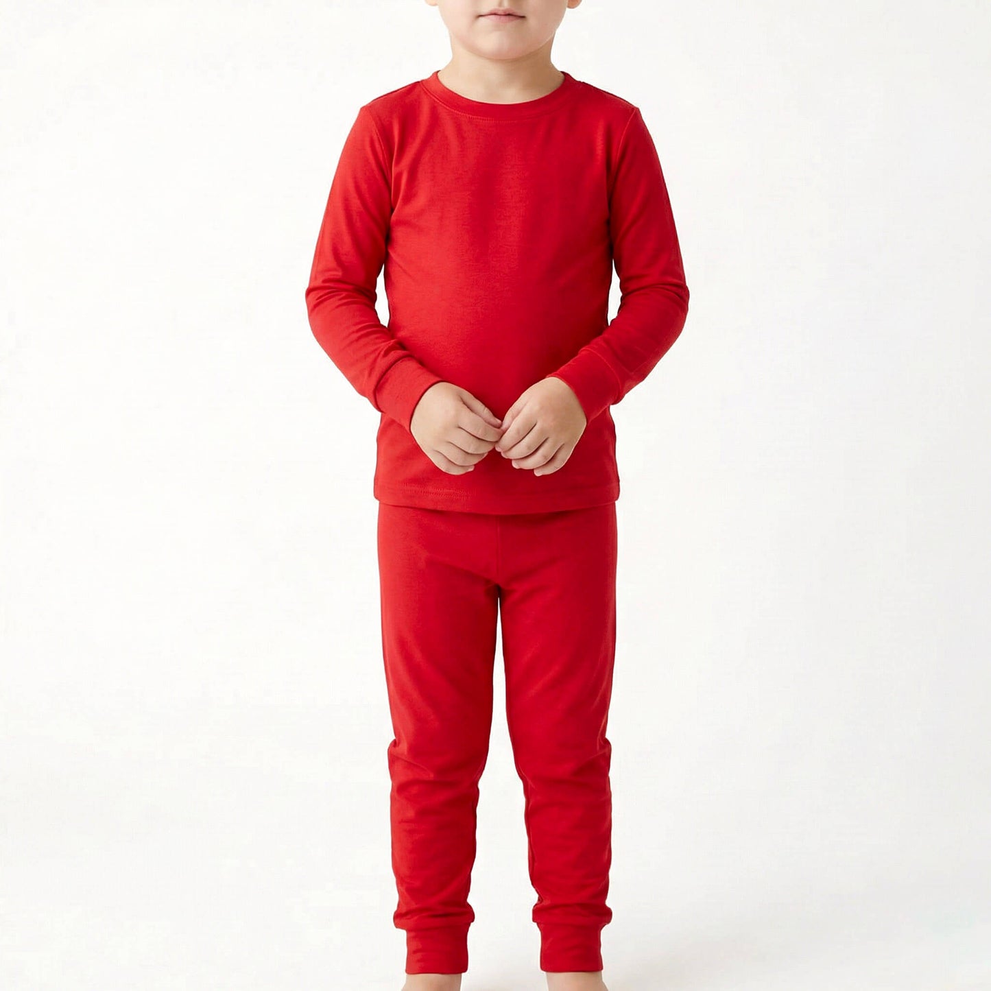 Child wearing a red outfit on a white background