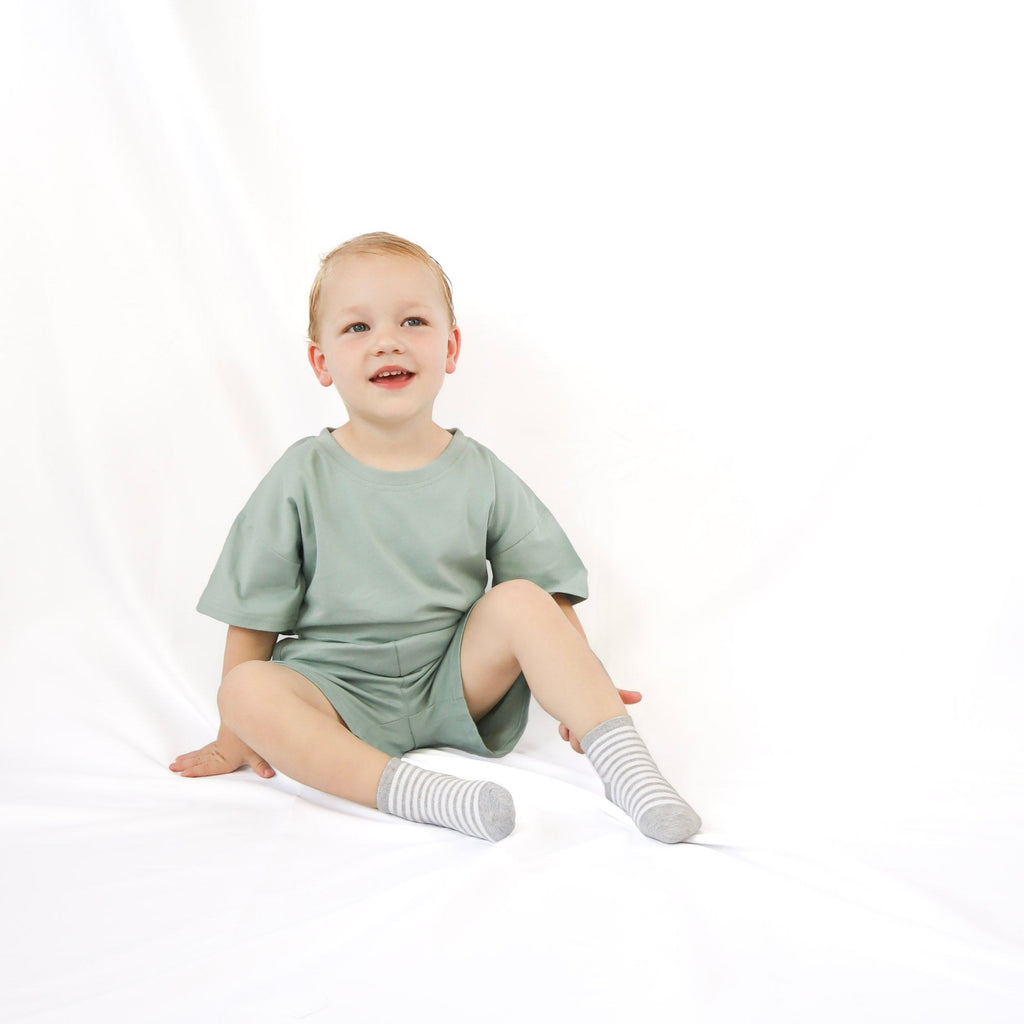 little boy wearing summer set in Sage Green color