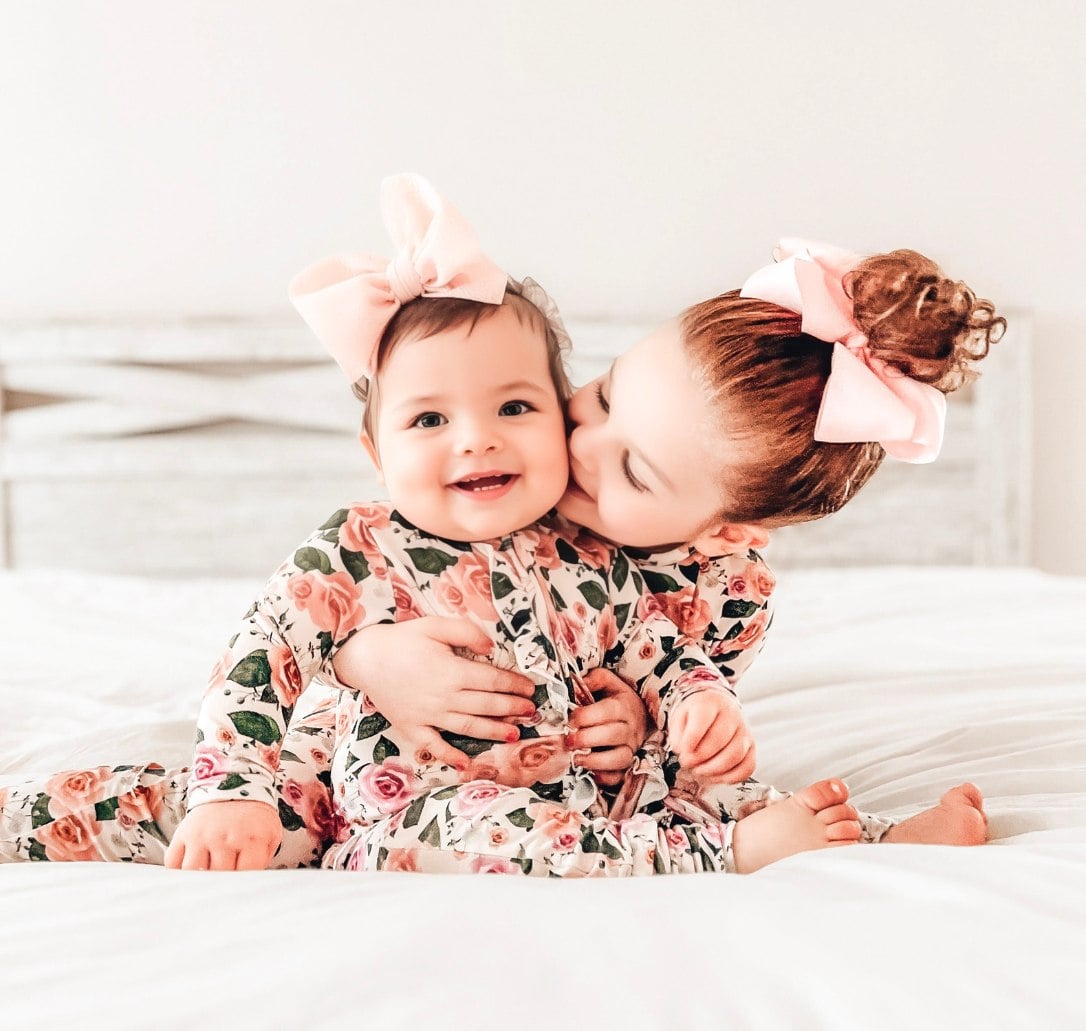 2 little girls wearing toddler 5T clothes in floral print