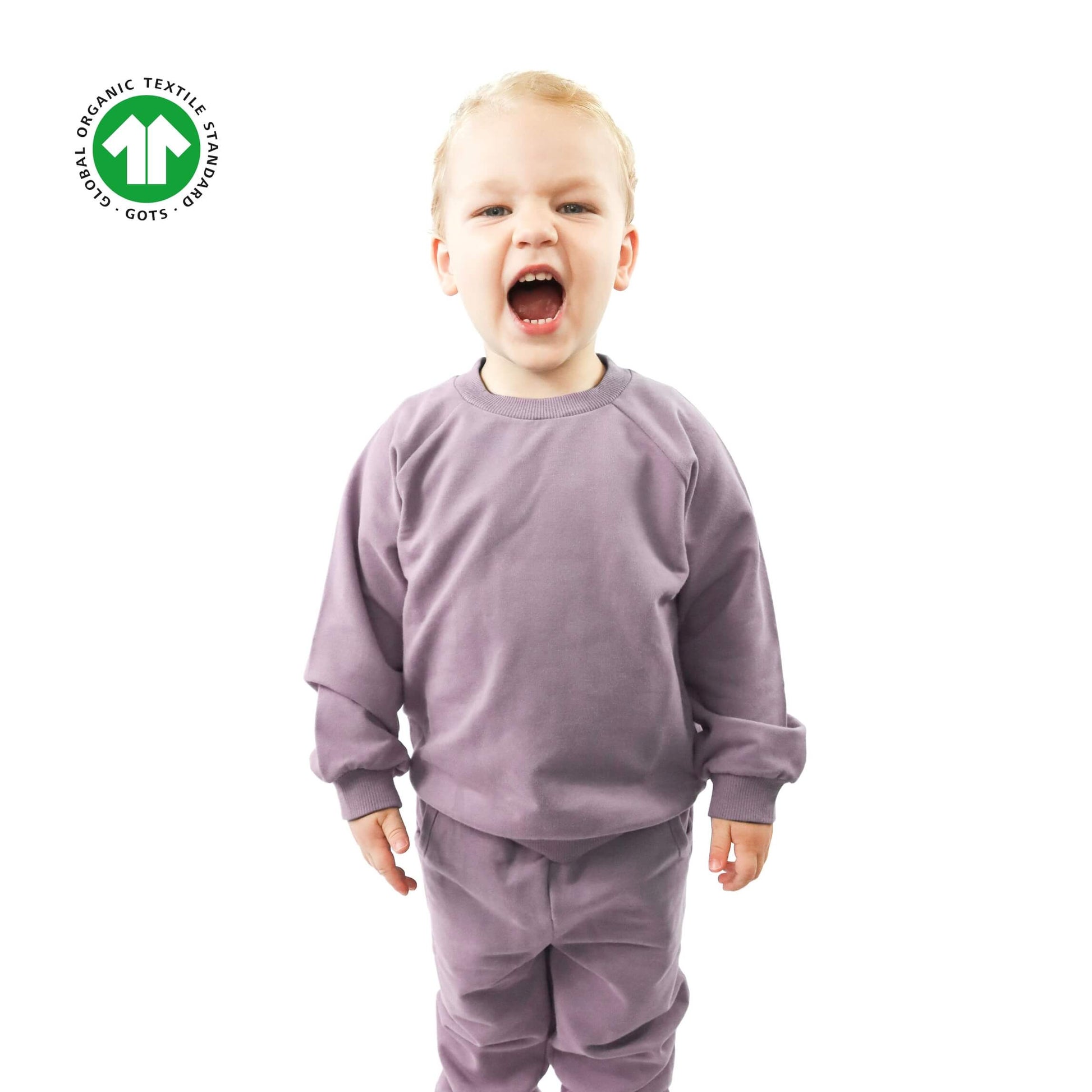 toddler wearing violet jogger set made of organic cotton