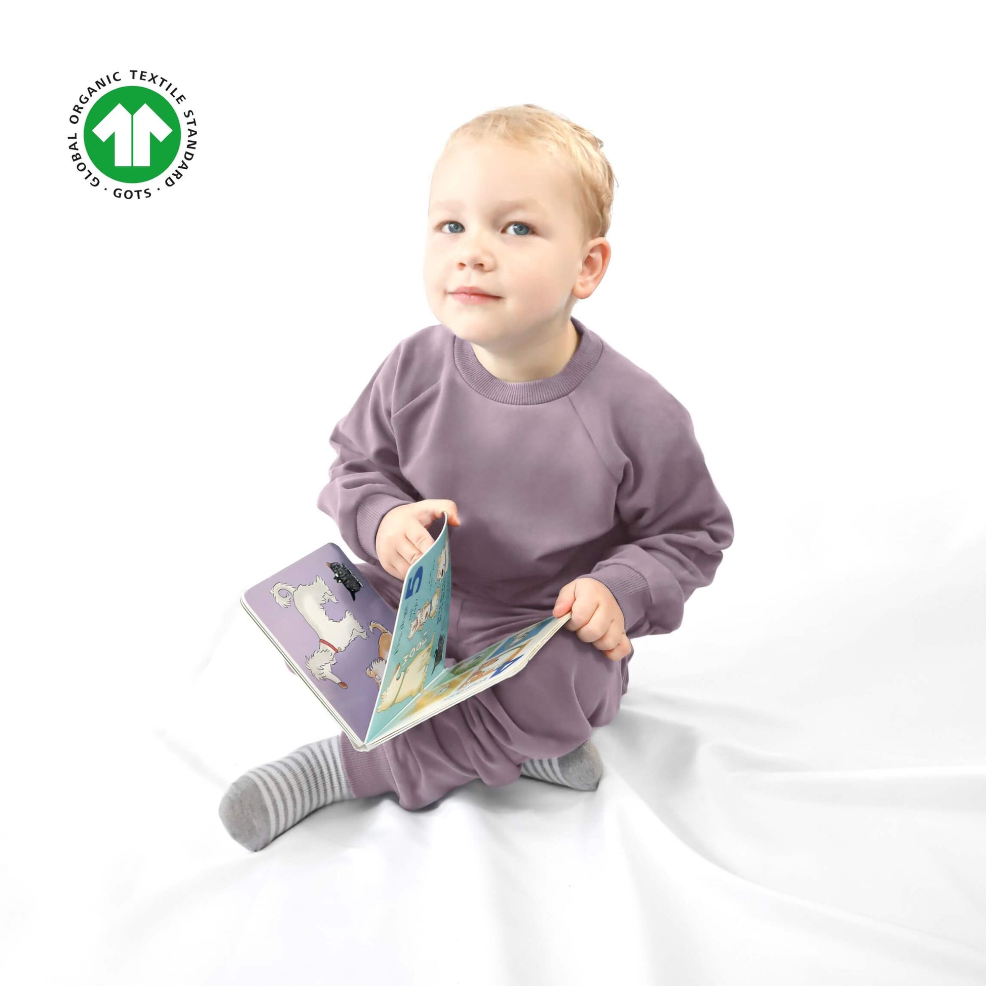 toddler wearing violet jogger set made of organic cotton