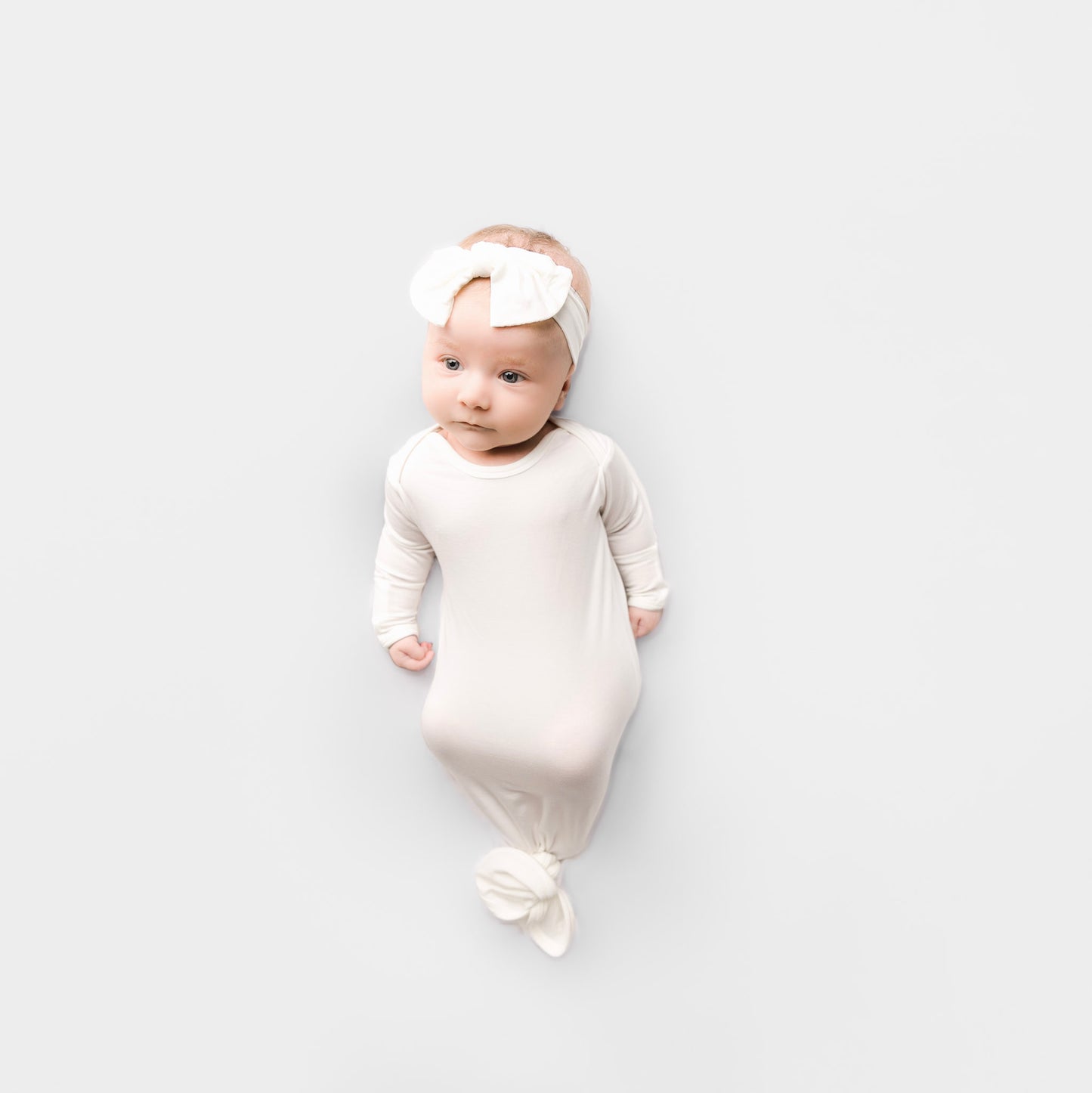 baby-girl-wearing-white-gown made of tencel lyocell 