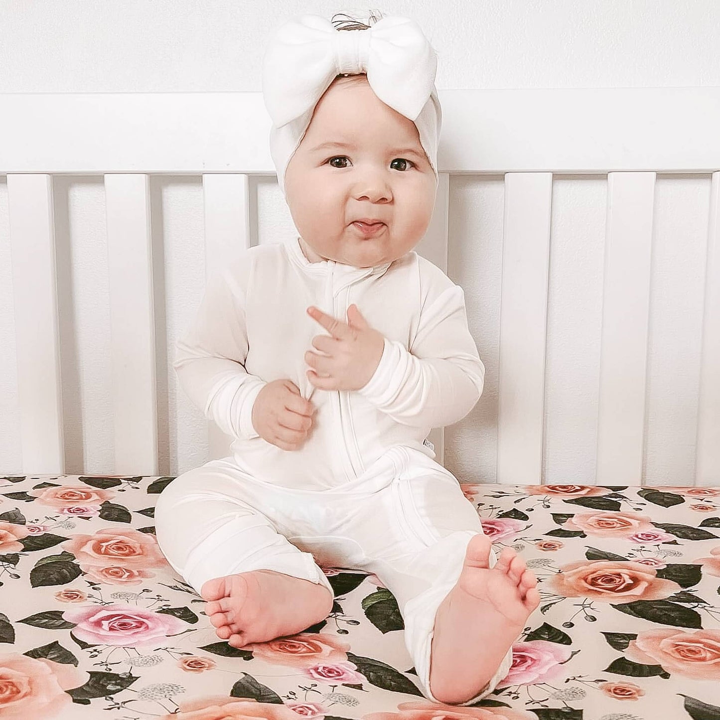 baby girl wearing white convertible footie made of Tencel Lyocell fabric 